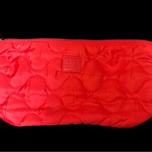 Vibrant Red Quilted Cosmetic Bag with Crescent Shape